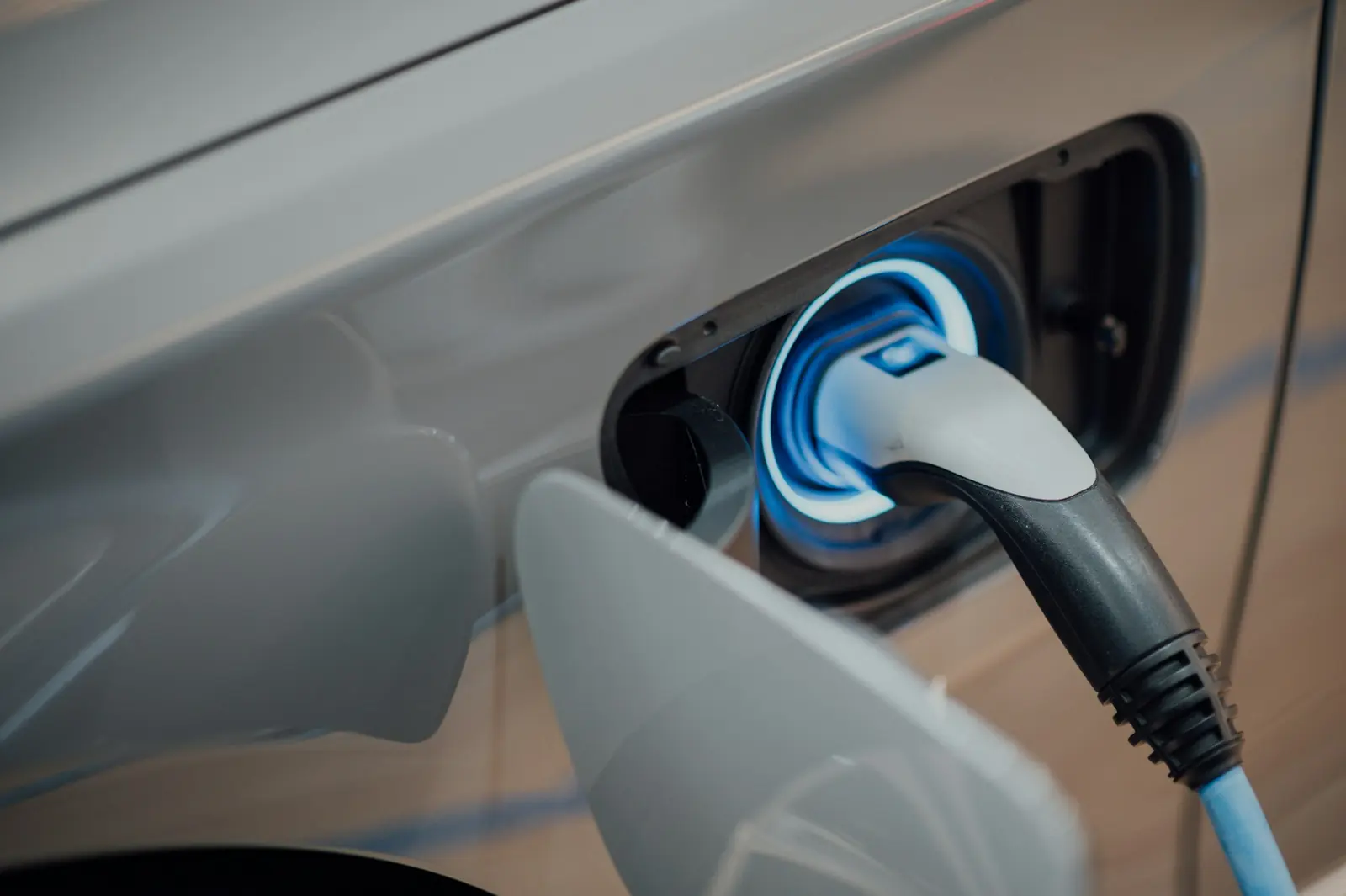 A charging connector plugged into an electric car